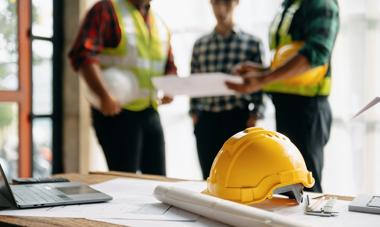 Hampshire Build vetted contractor panel — architects and builders reviewing extension drawings and plans